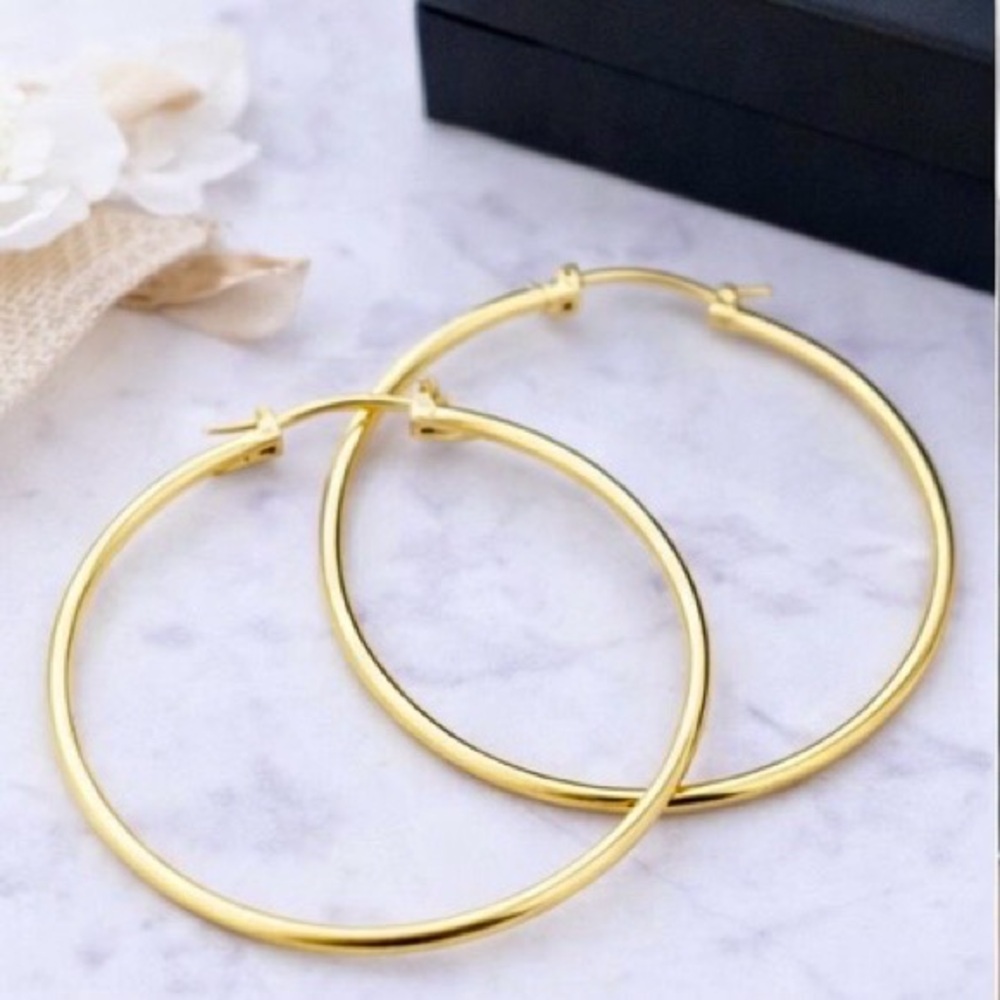 10k Solid Yellow Gold Large High
Polished hoop Earrings. 50mm x 2MM
3.00gr